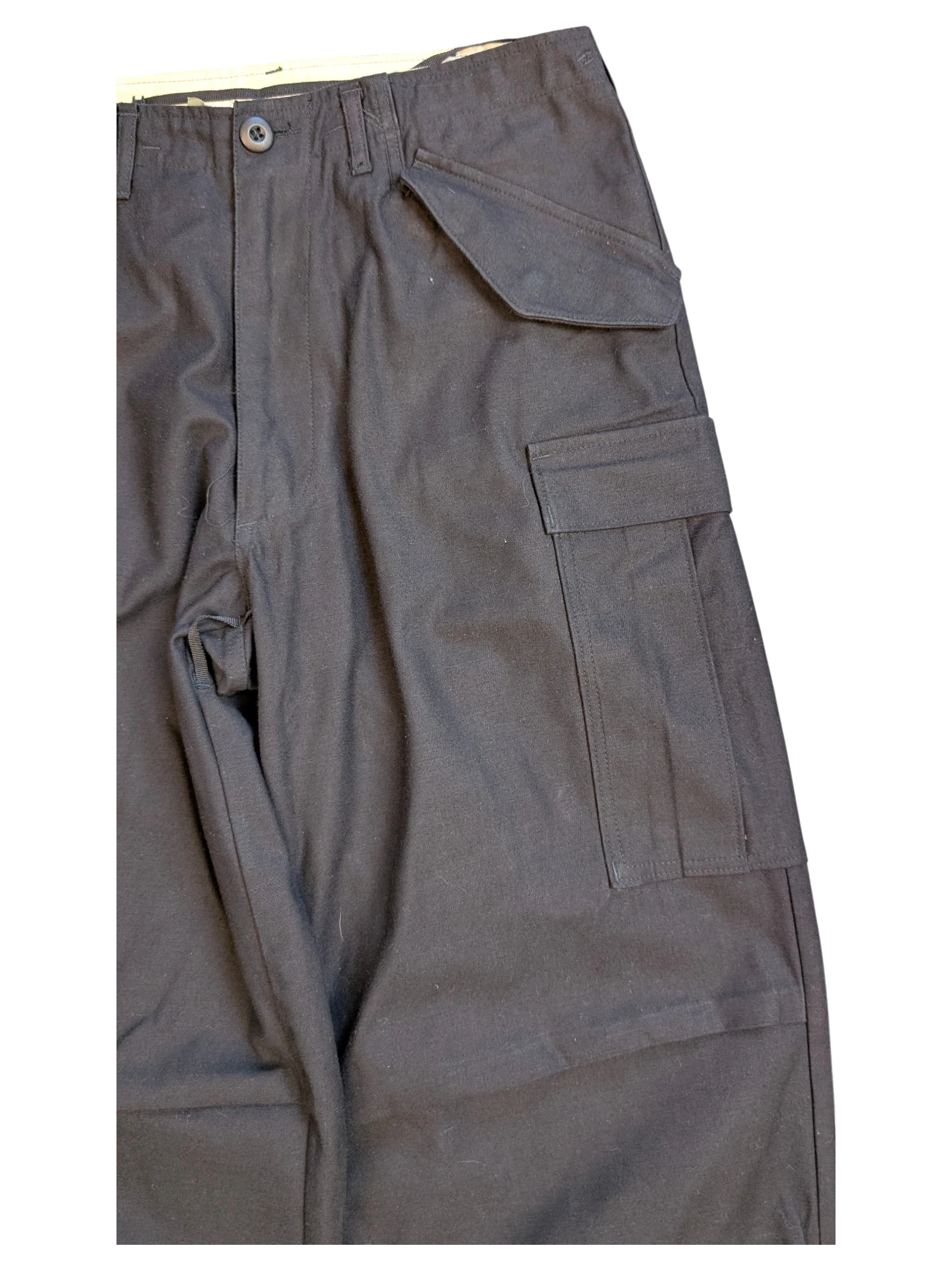 JAKE & IPI black cotton cargo pants with multiple pockets and button closure.