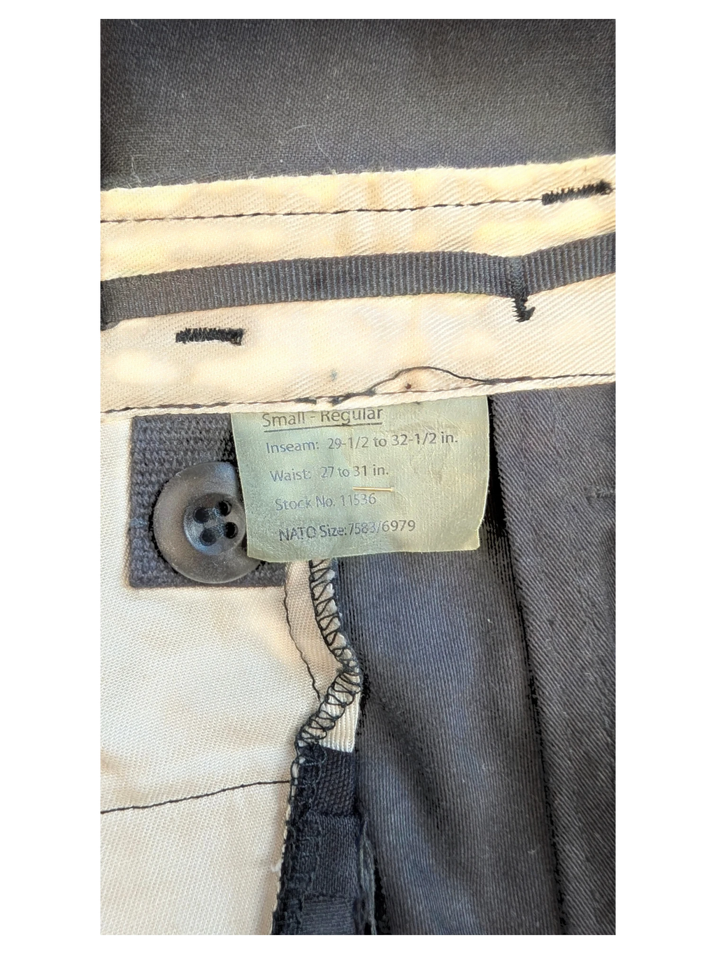 JAKE & IPI black cargo pants, size Small Regular, with button closure and internal size tag.