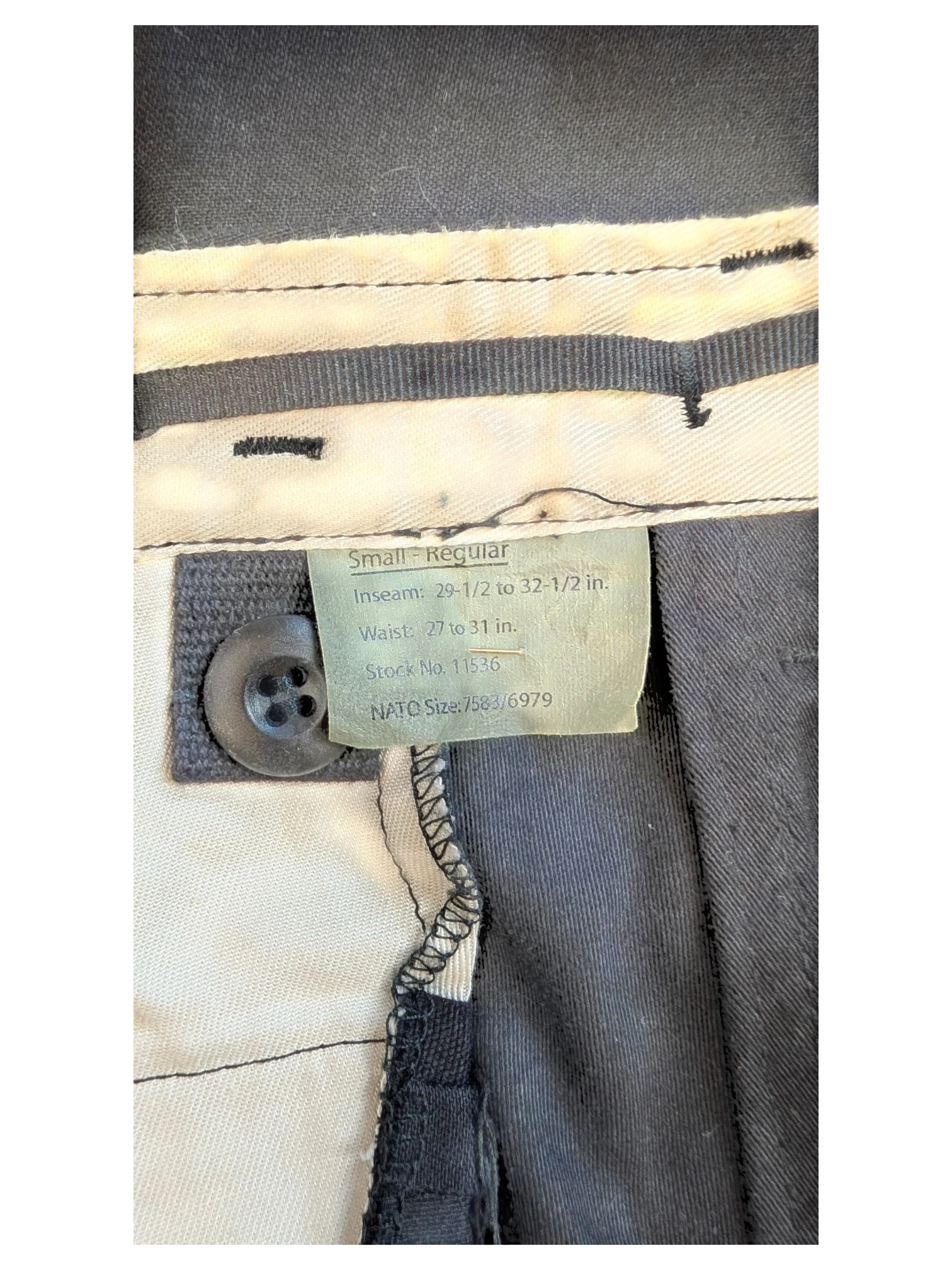 JAKE & IPI black cargo pants, size Small Regular, with button closure and internal size tag.