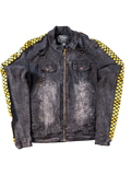 JAKE & IPI Rage of a Rebellion black denim jacket with distressed details and yellow checkered racing stripes on sleeves.