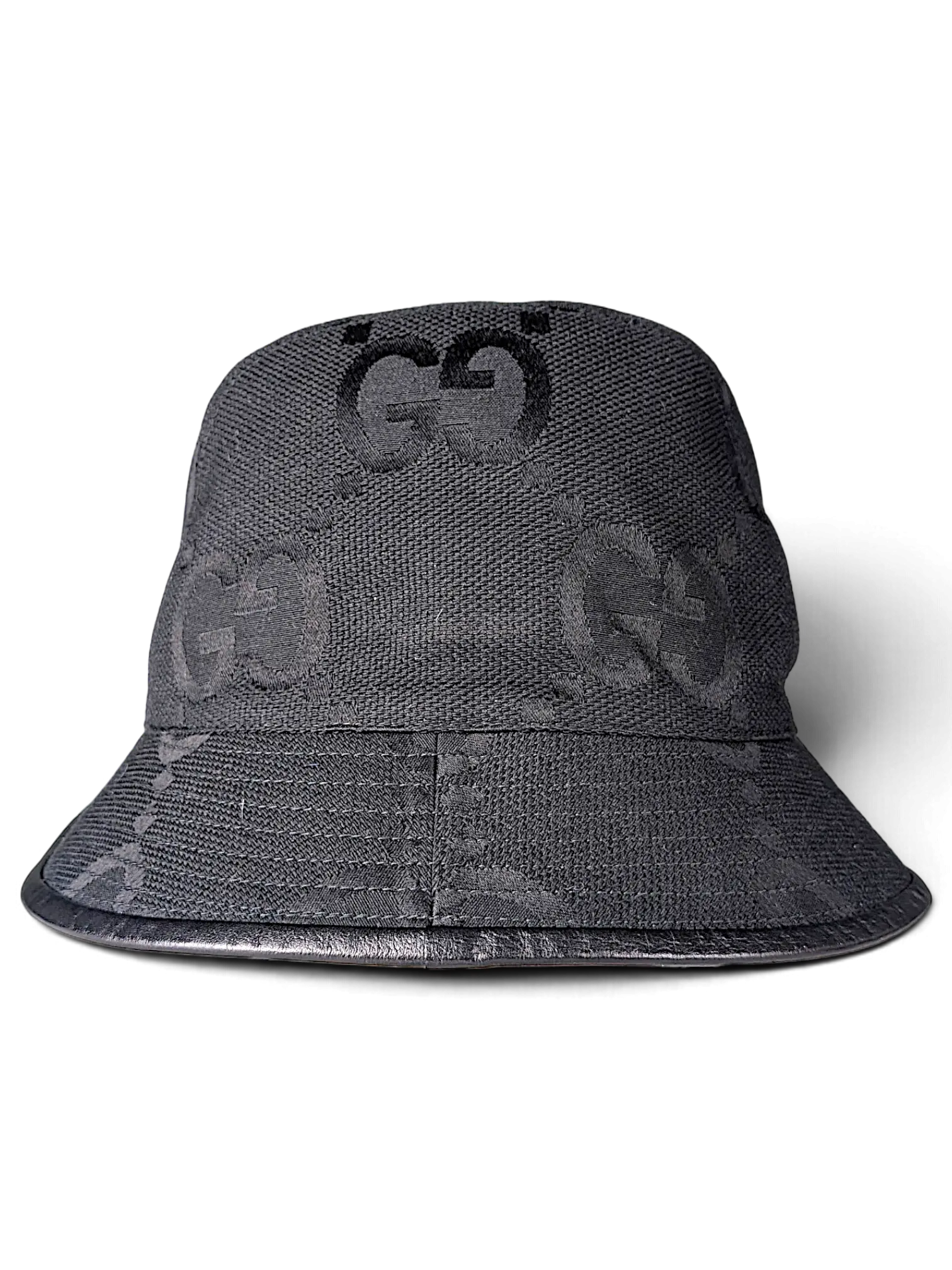 JAKE & IPI black Gucci bucket hat featuring the iconic GG monogram pattern and a leather brim trim.