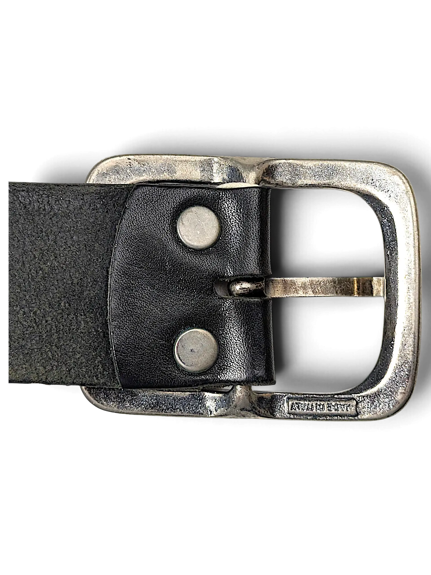 JAKE & IPI black leather belt featuring a distressed silver metal buckle and two rivets, close-up view.
