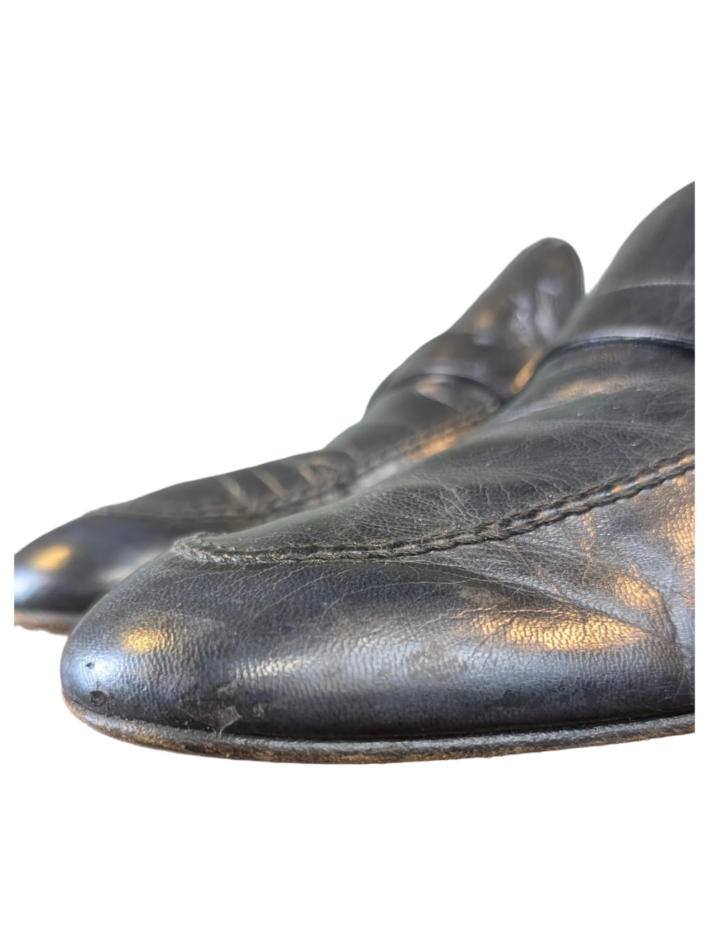 JAKE & IPI black leather loafers with visible stitching detail on a dark background