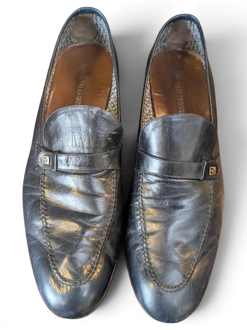 JAKE & IPI black leather loafers with a strap detail and patterned interior lining