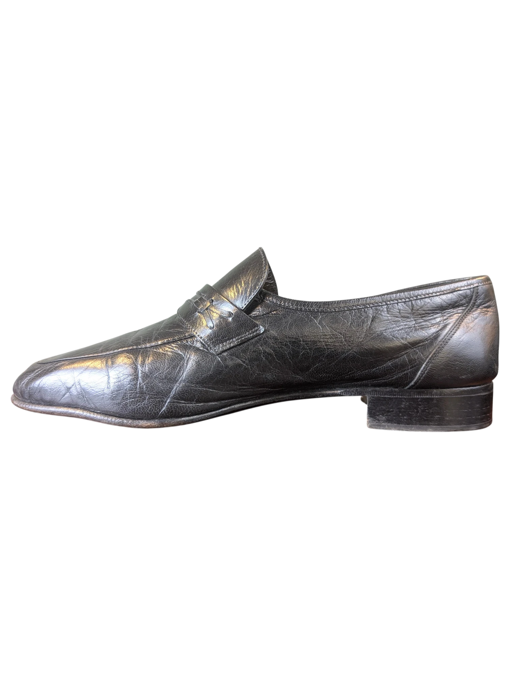 JAKE & IPI black leather penny loafers with a textured finish and low block heel, side view.