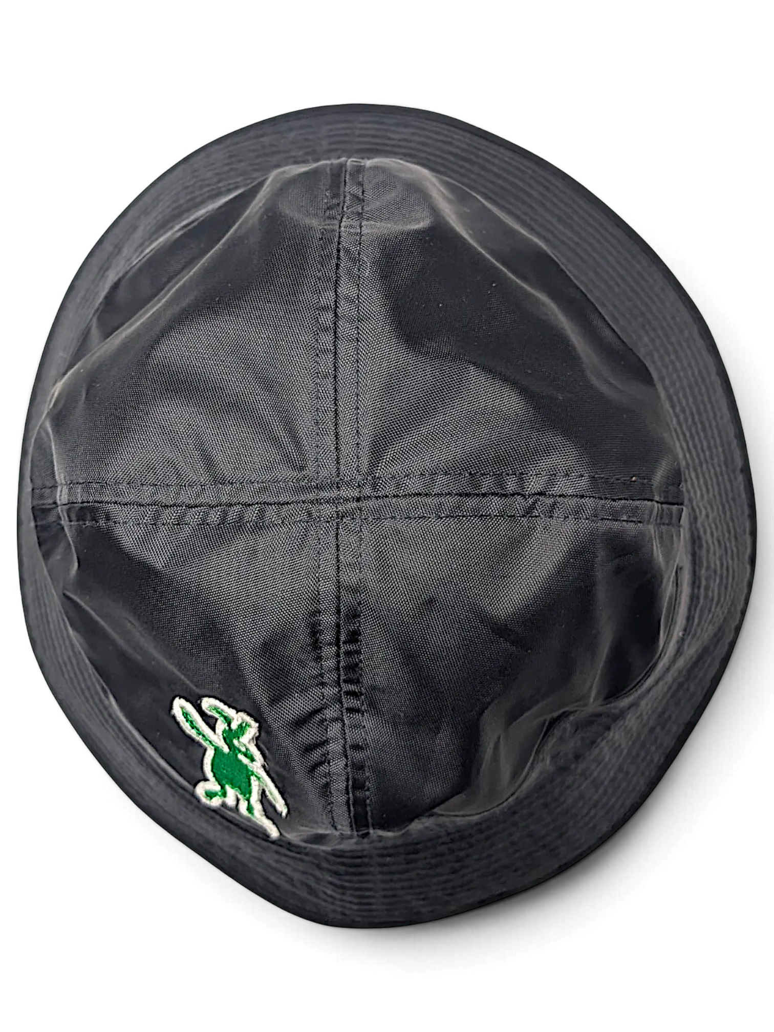 JAKE & IPI Marni bucket hat in black nylon with a green embroidered logo detail, top-down view.