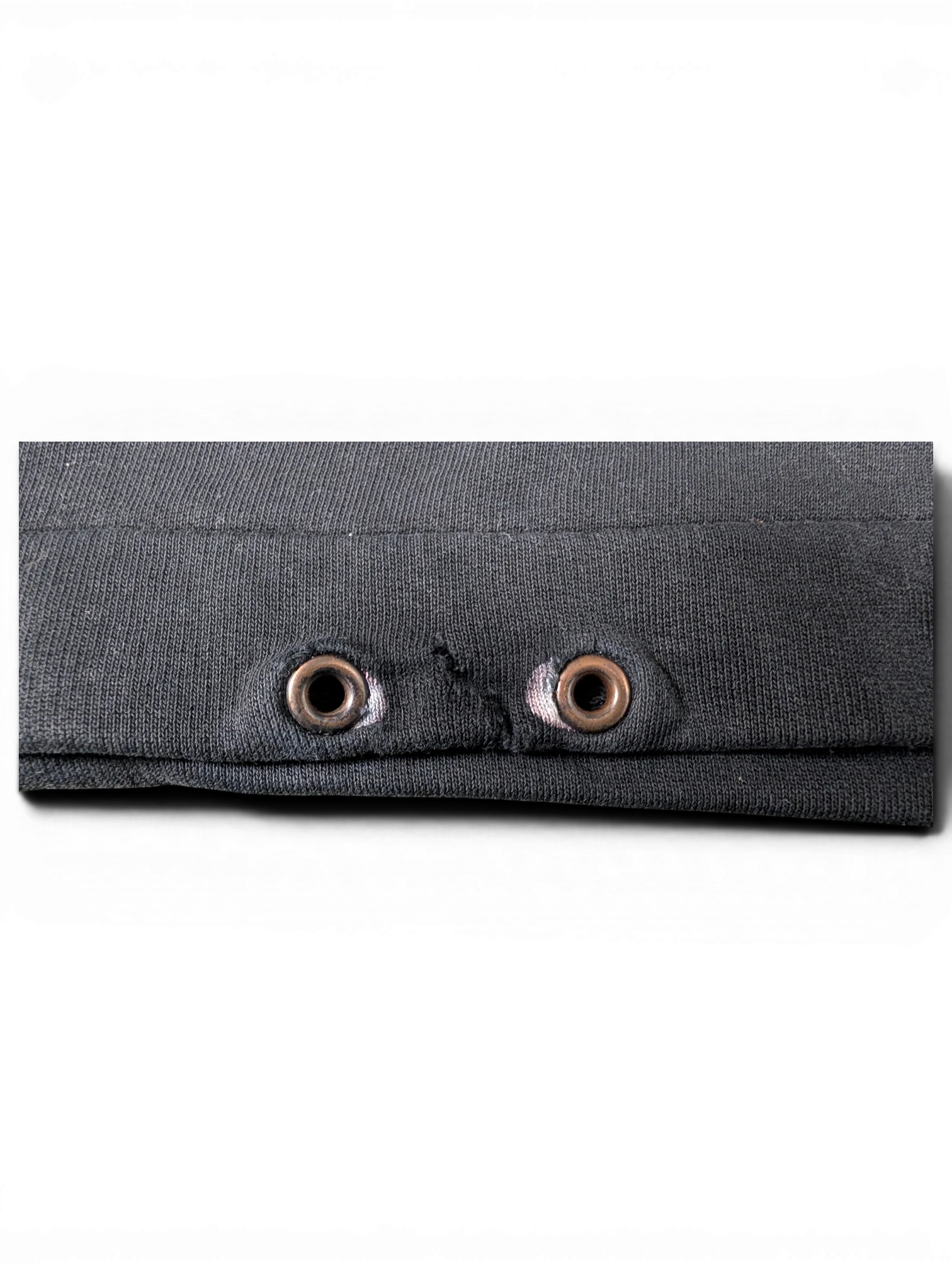 JAKE & IPI black cotton sweatshirt featuring metal eyelet details on the hood drawstring area.