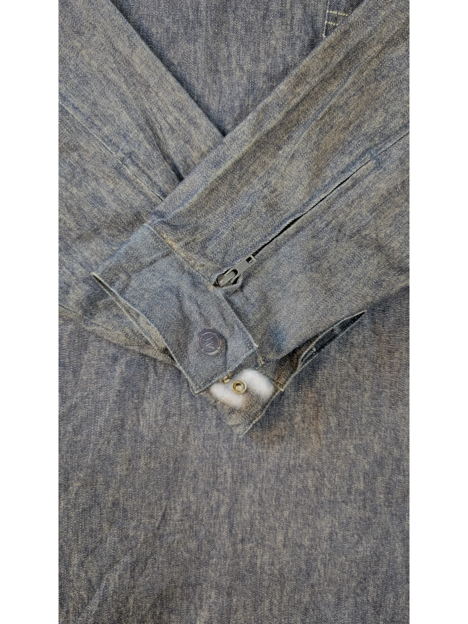 JAKE & IPI blue denim Willie Esco jacket with button cuffs and zipper detail on sleeve.