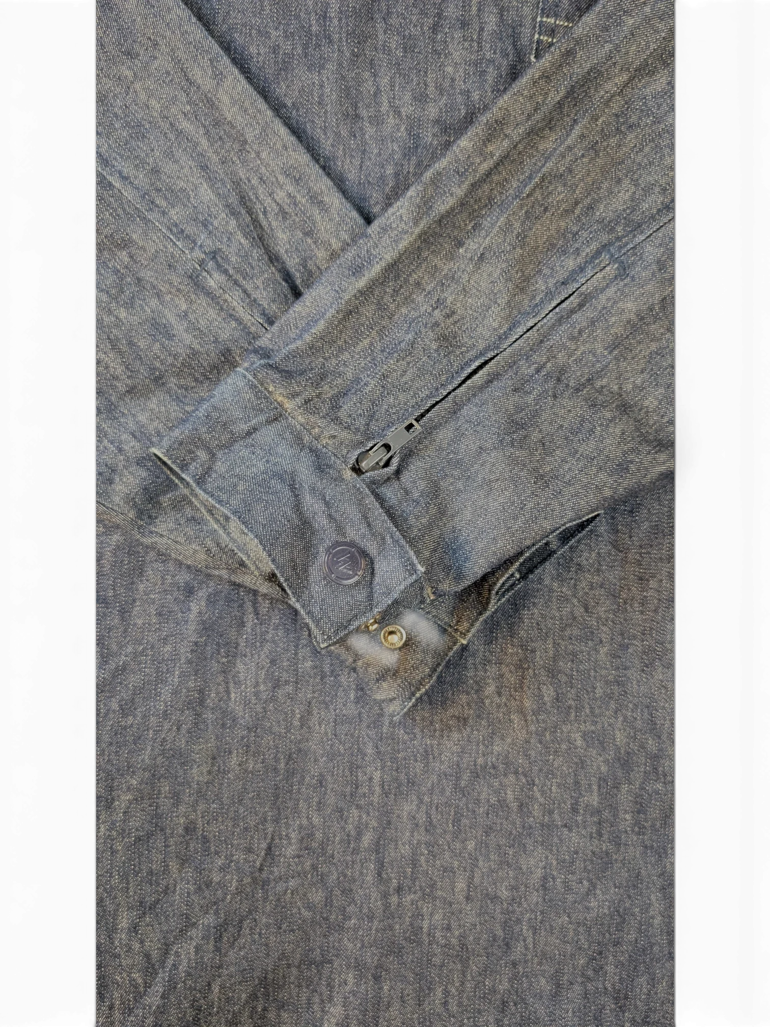 JAKE & IPI blue denim Willie Esco jacket with button cuffs and zipper detail on sleeve.