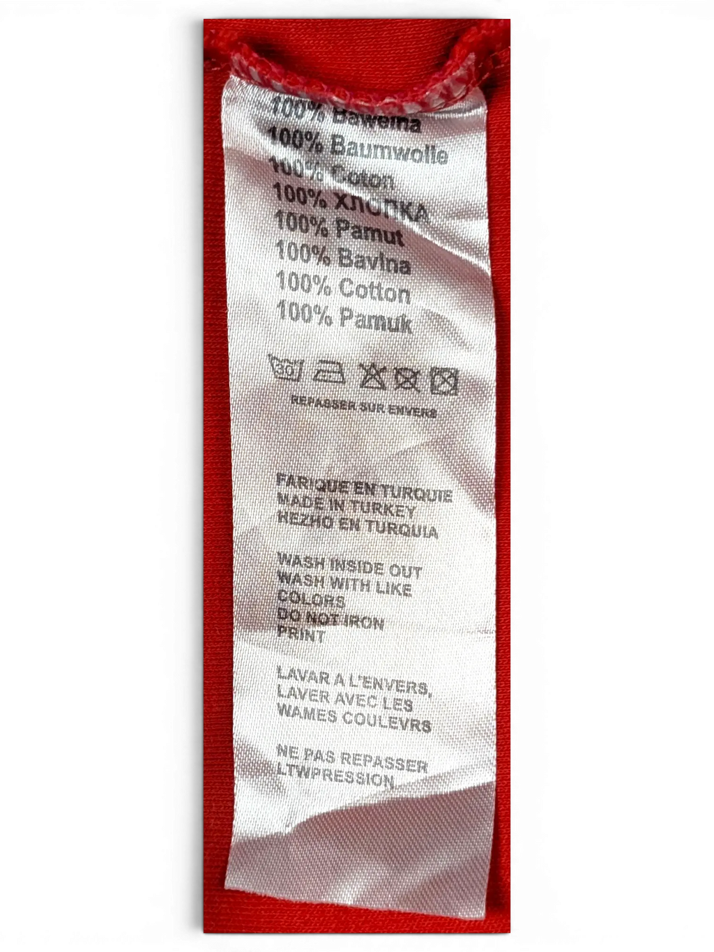 JAKE & IPI BOSS Green polo shirt interior fabric care label showing 100 percent cotton composition and care symbols