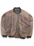 JAKE & IPI brown distressed leather bomber jacket with plaid lining and zippered pockets.