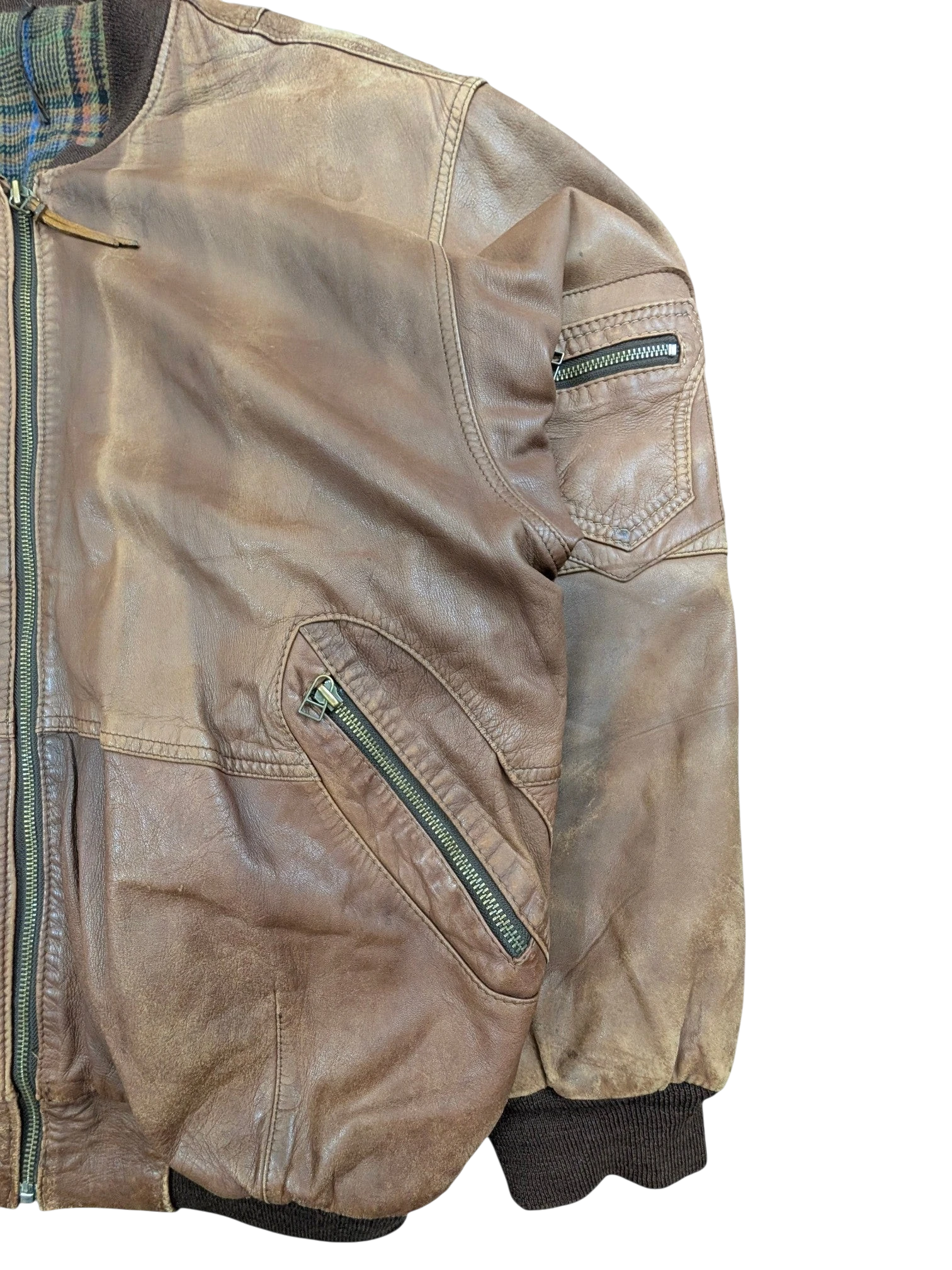 JAKE & IPI brown distressed leather bomber jacket with plaid lining and zippered pockets.