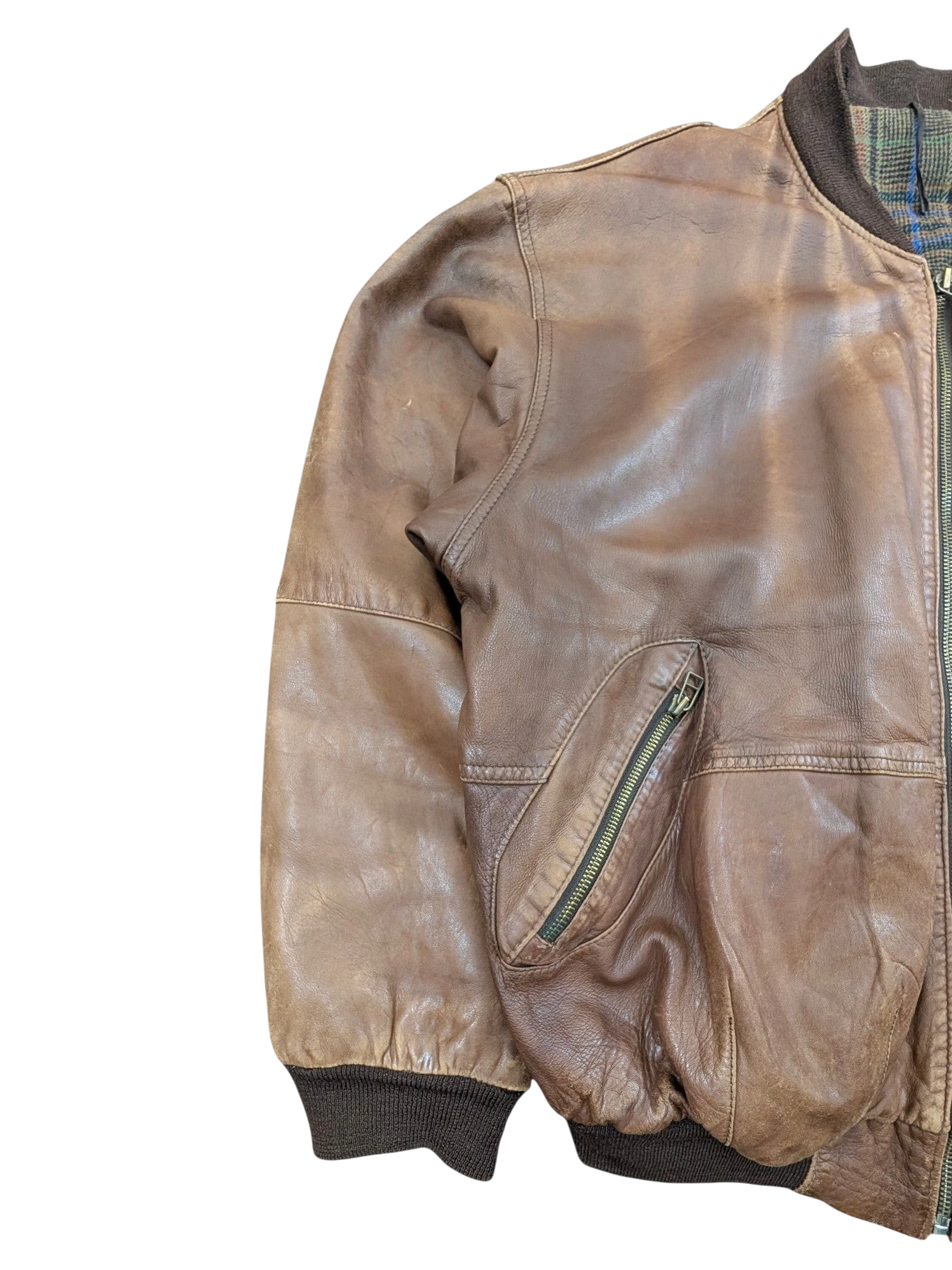 JAKE & IPI brown distressed leather bomber jacket with zippered pocket and plaid lining.