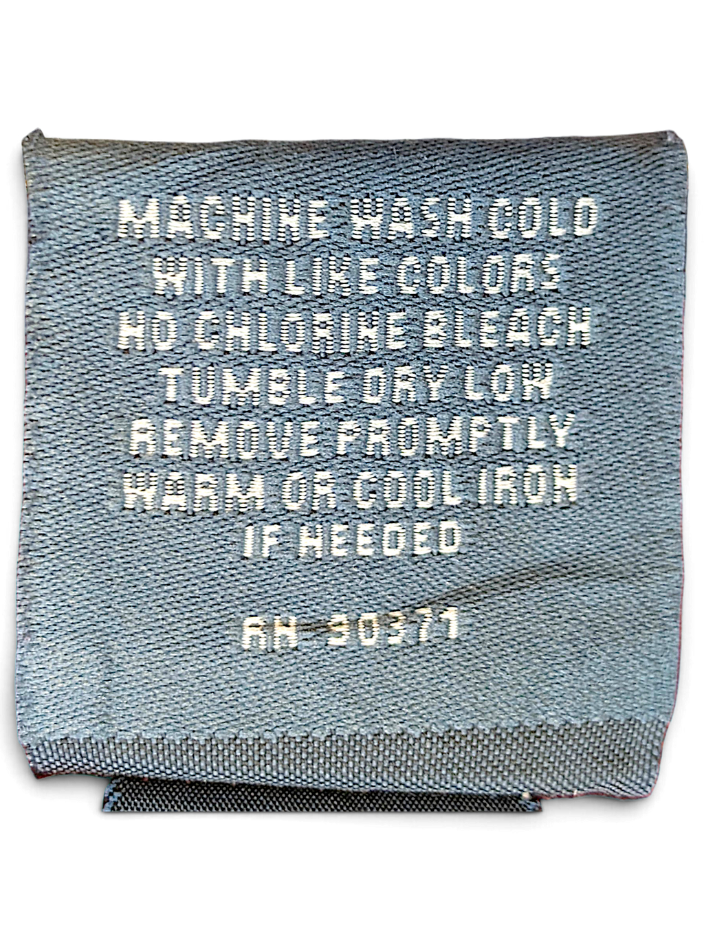 JAKE & IPI Camp David College garment care label showing cotton polyester blend and washing instructions