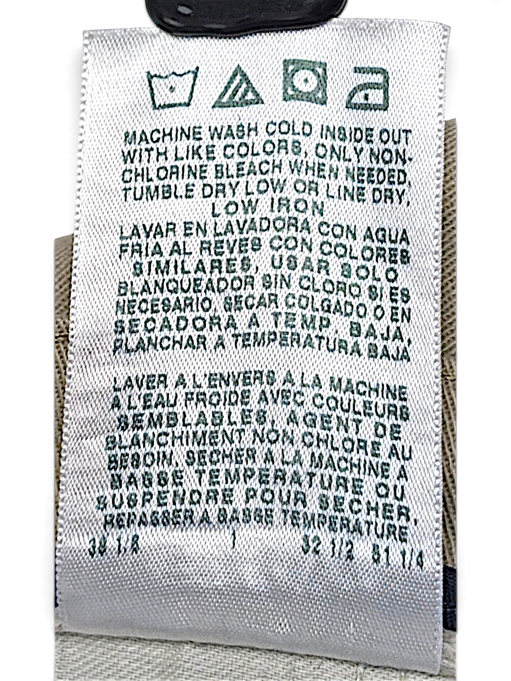 JAKE & IPI care label for vintage beige pleated trousers with washing instructions in English, Spanish, and French.