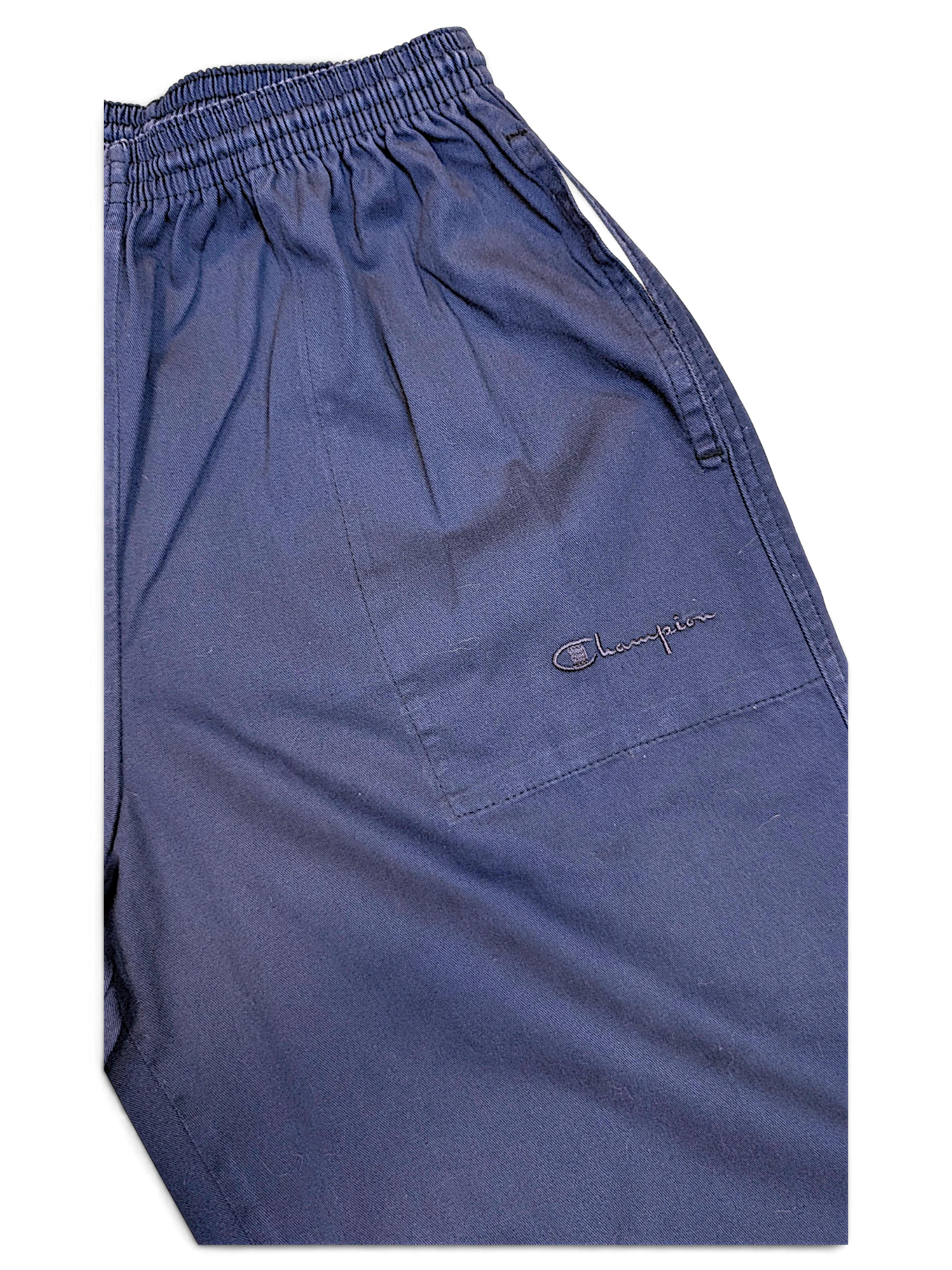 JAKE & IPI pre-owned Champion track pants in faded blue with an elasticated waistband and embroidered logo detail.