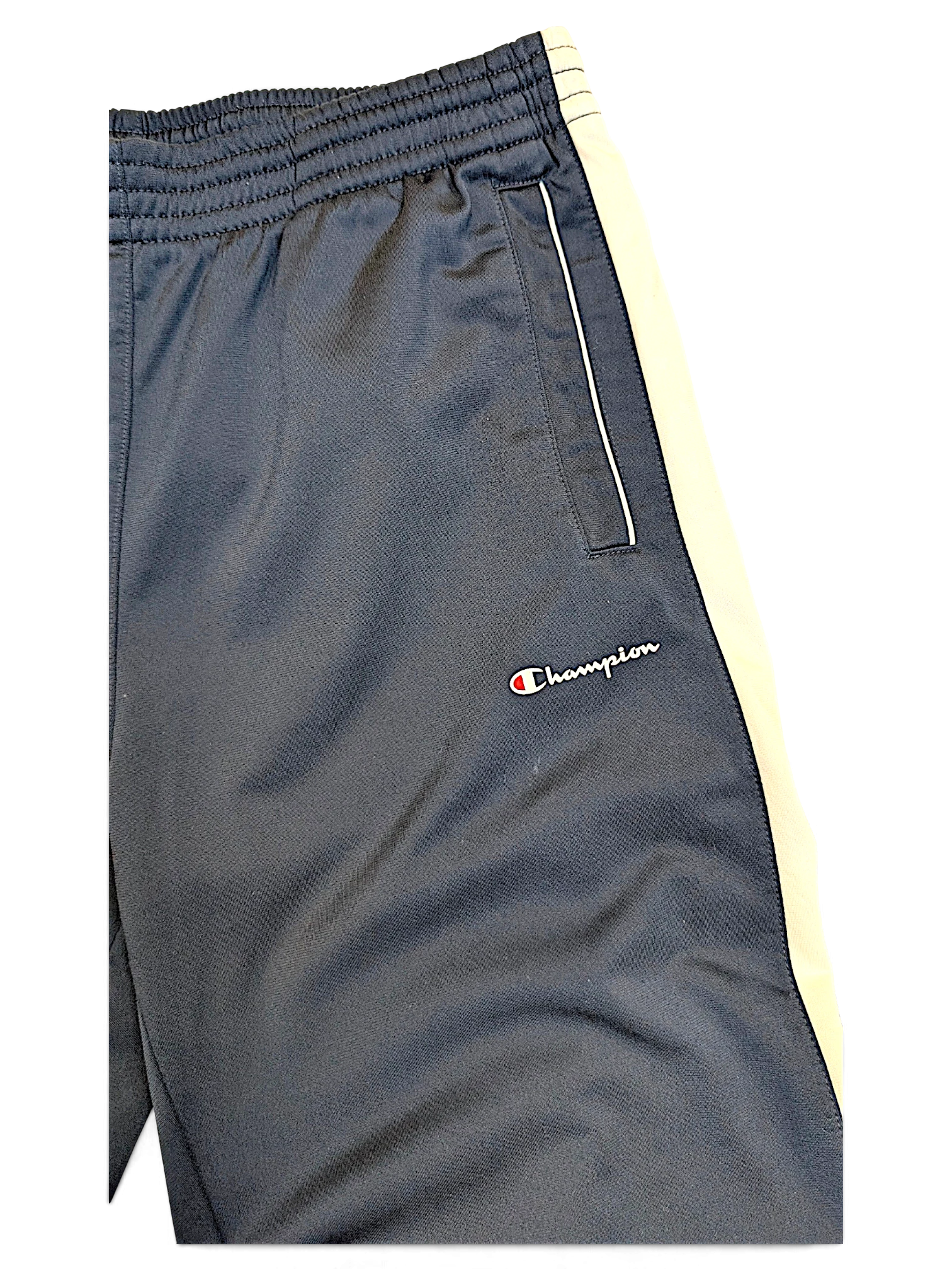 JAKE & IPI Champion navy track pants featuring a white side stripe and embroidered logo detail.