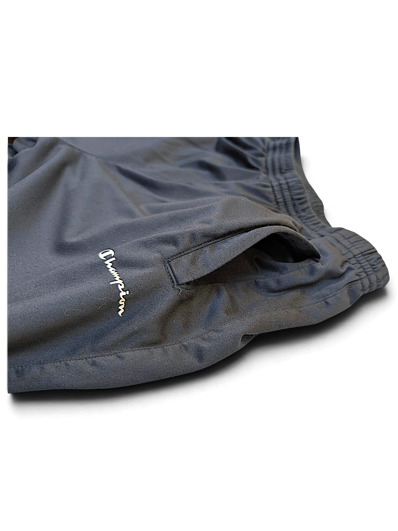 JAKE & IPI Champion navy track pants featuring an embroidered logo and side pocket detail