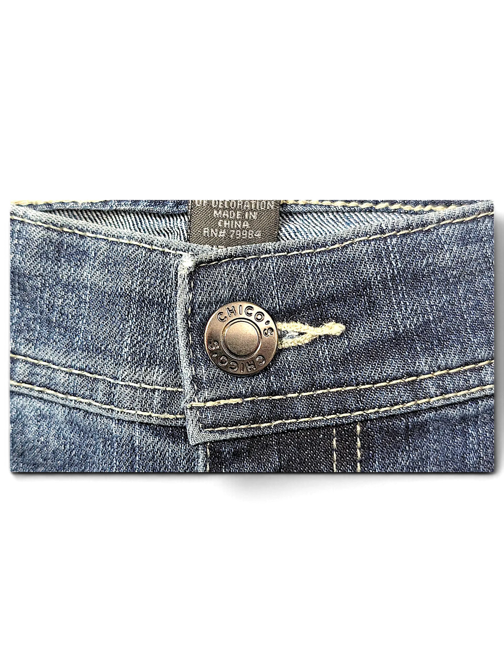 JAKE & IPI Additions by Chico's denim shorts featuring a branded metal button and contrast stitching detail.