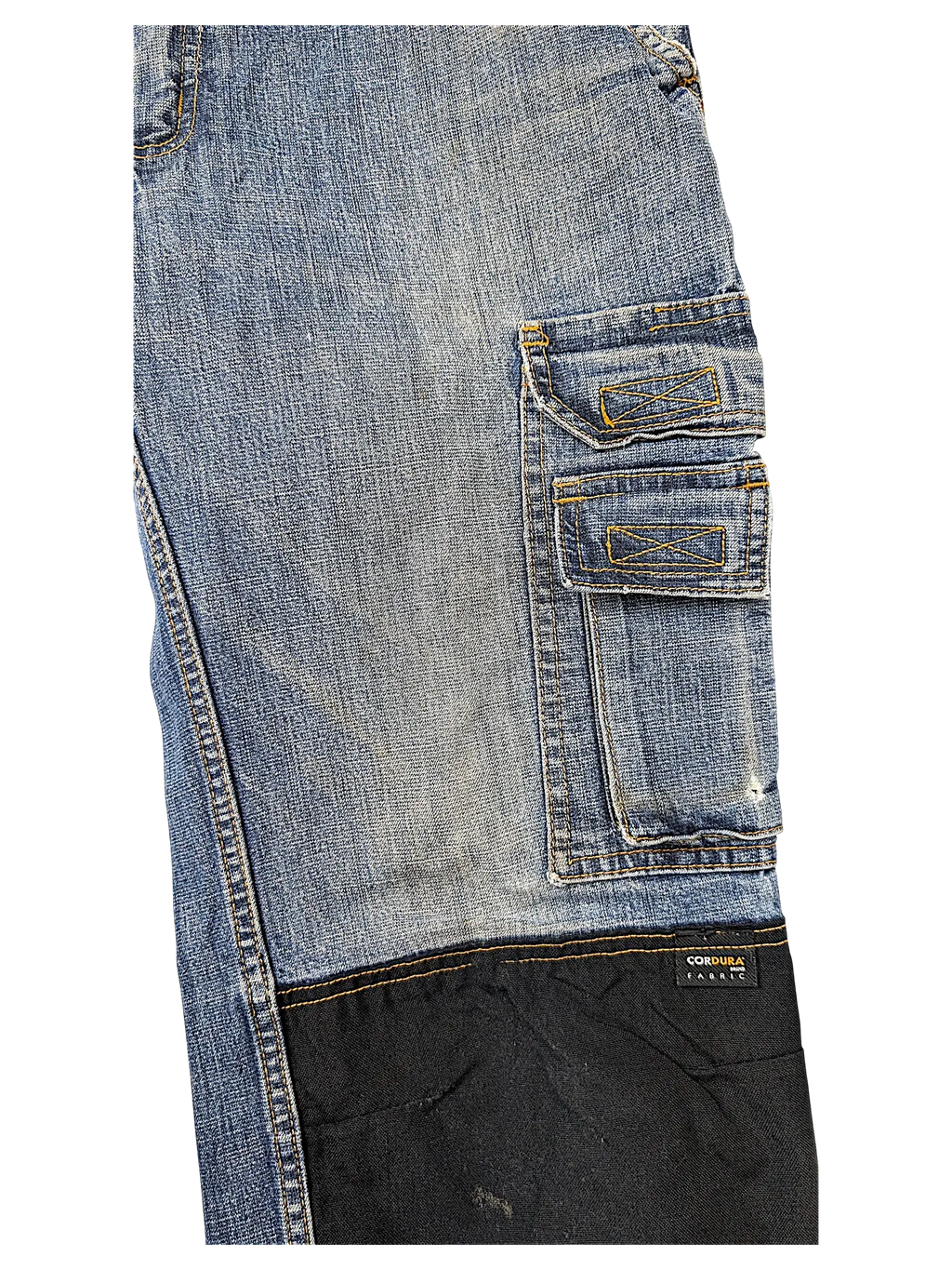 JAKE & IPI blue denim cargo jeans featuring durable black Cordura brand fabric reinforced panels on the lower leg.