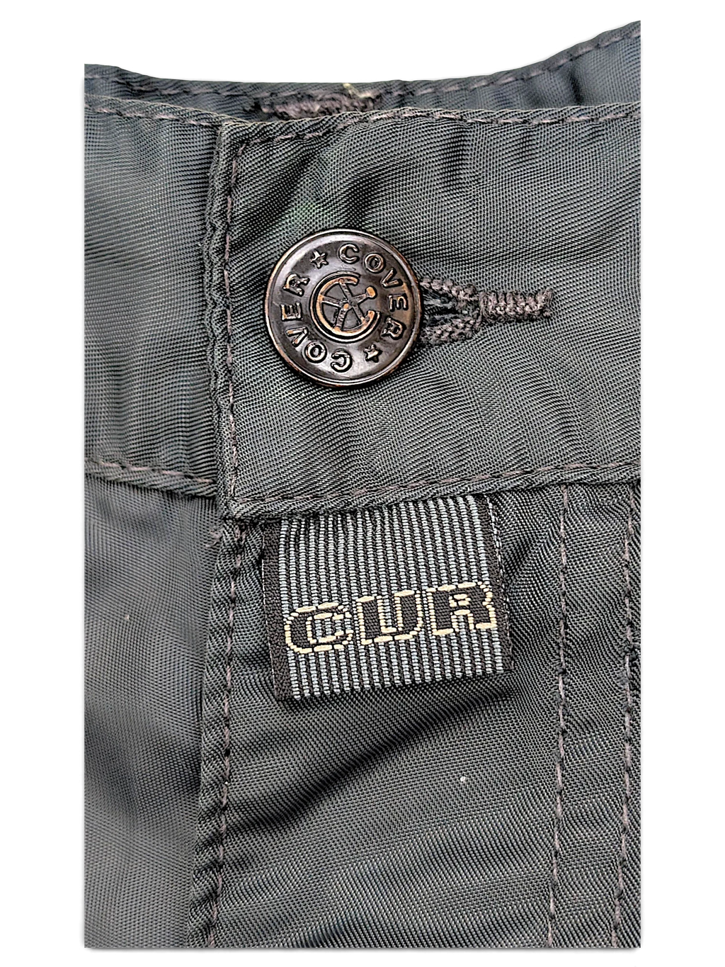 JAKE & IPI dark green cargo pants featuring a branded metal button and a woven label detail on the front