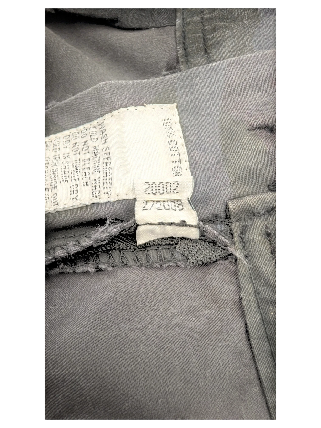 JAKE & IPI dark grey 100% cotton cargo pants with care tag detail.