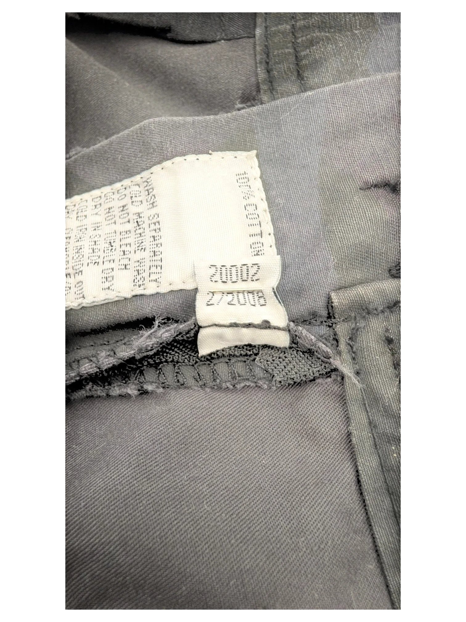 JAKE & IPI dark grey 100% cotton cargo pants with care tag detail.