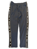 JAKE & IPI pre-owned dark grey DC track pants with branded logo side tape and a relaxed straight-leg fit.