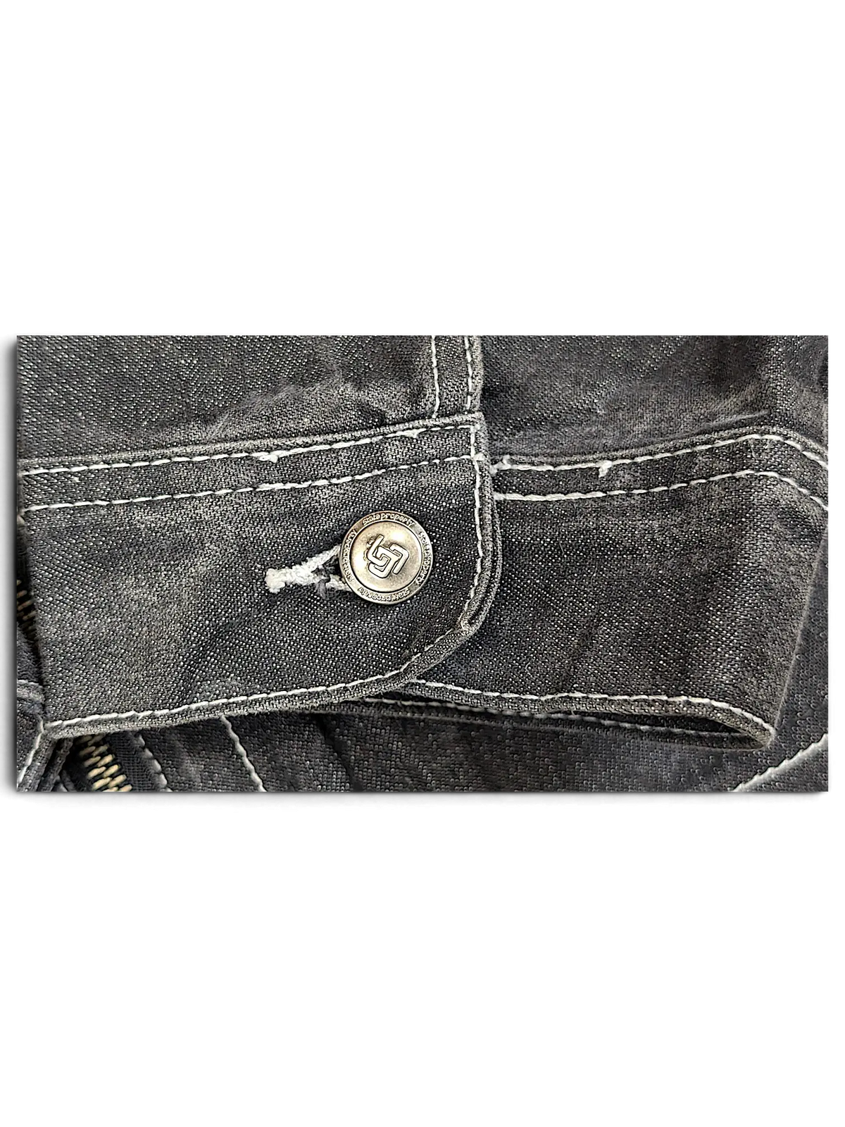 JAKE & IPI State Property dark wash denim work jacket cuff with white contrast stitching and branded metal button