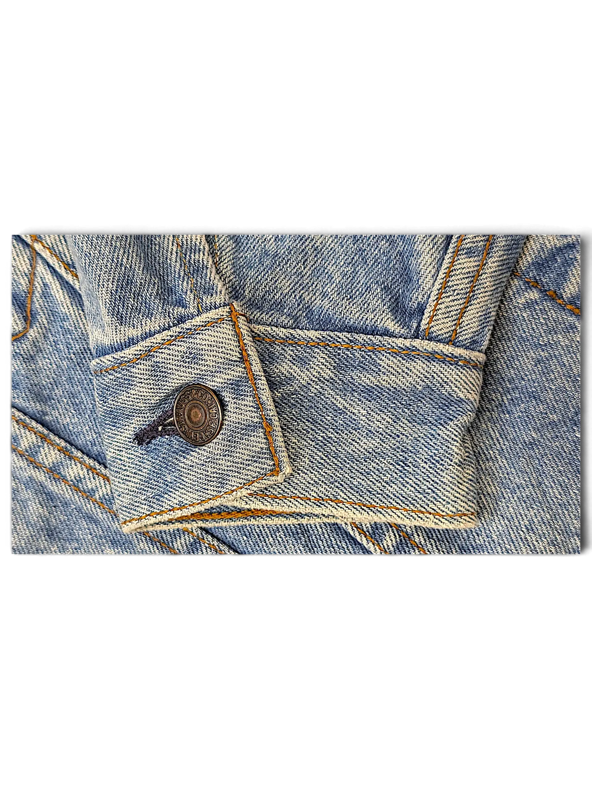 JAKE & IPI light wash blue denim jacket sleeve cuff with metallic button and contrast stitching