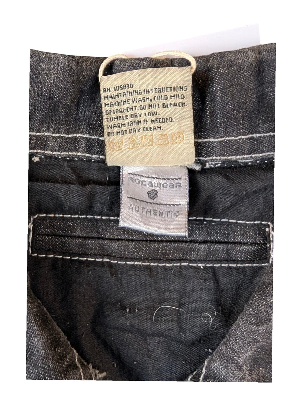 JAKE & IPI State Property dark wash denim jacket with white contrast stitching. Features Rocawear Authentic label.