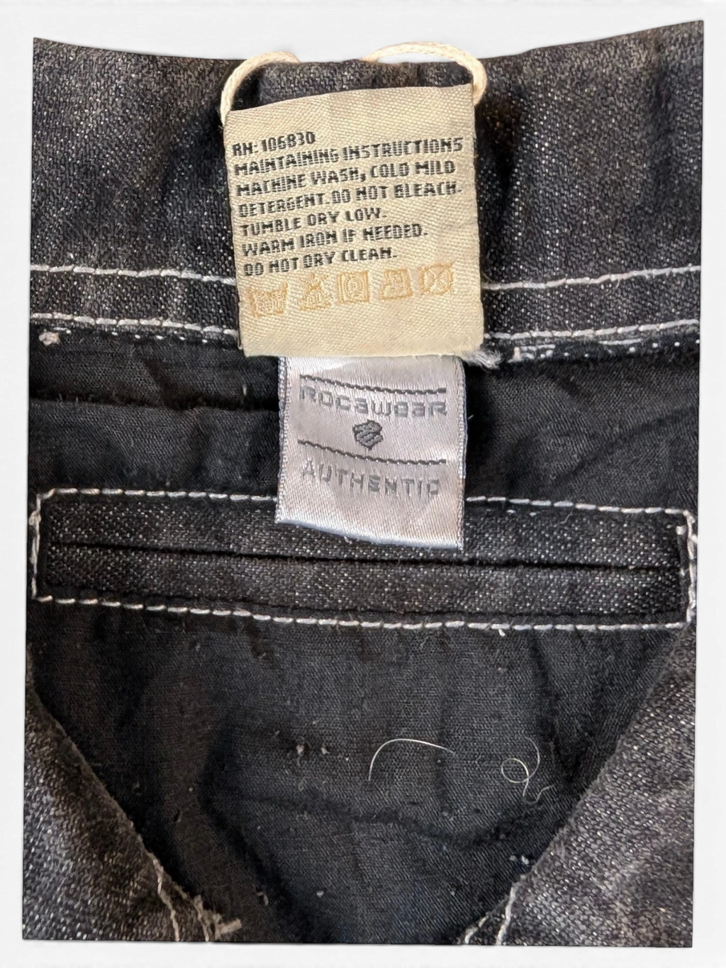 JAKE & IPI State Property dark wash denim jacket with white contrast stitching. Features Rocawear Authentic label.