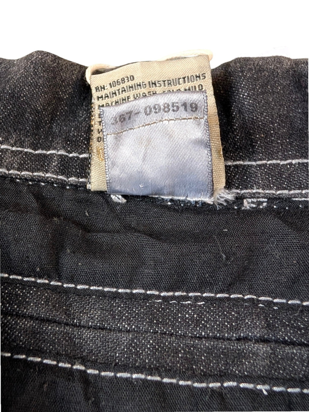 JAKE & IPI State Property dark wash denim jacket with white contrast stitching and care label.