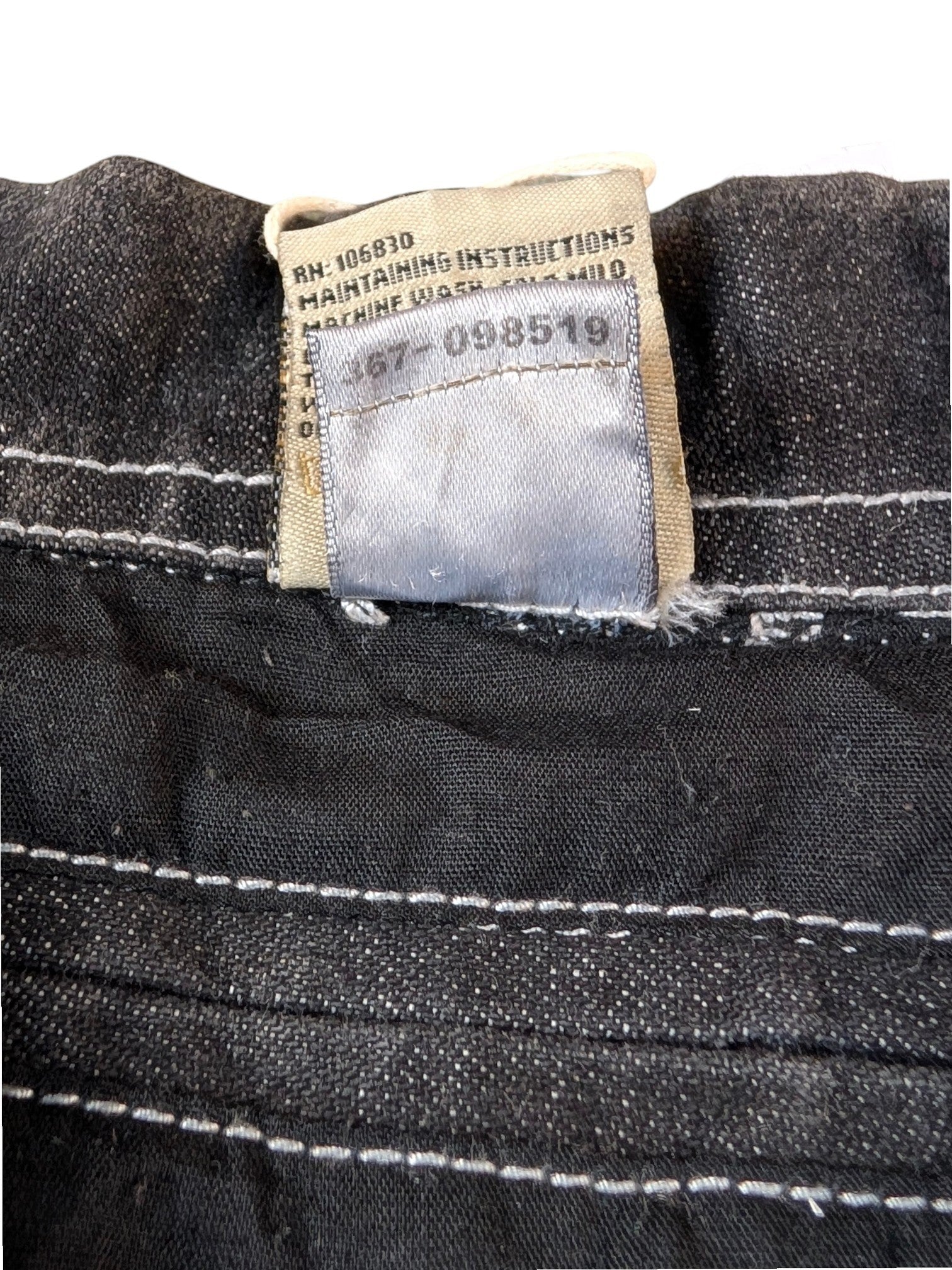 JAKE & IPI State Property dark wash denim jacket with white contrast stitching and care label.