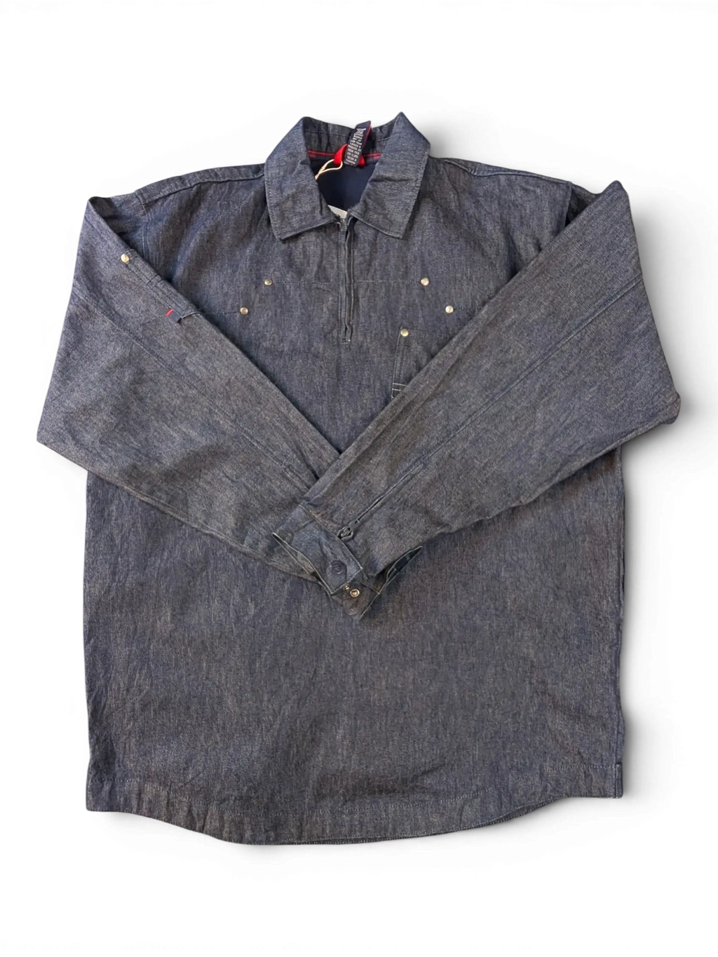 JAKE & IPI Willie Esco denim jacket with quarter zip, button cuffs, and brass stud details.