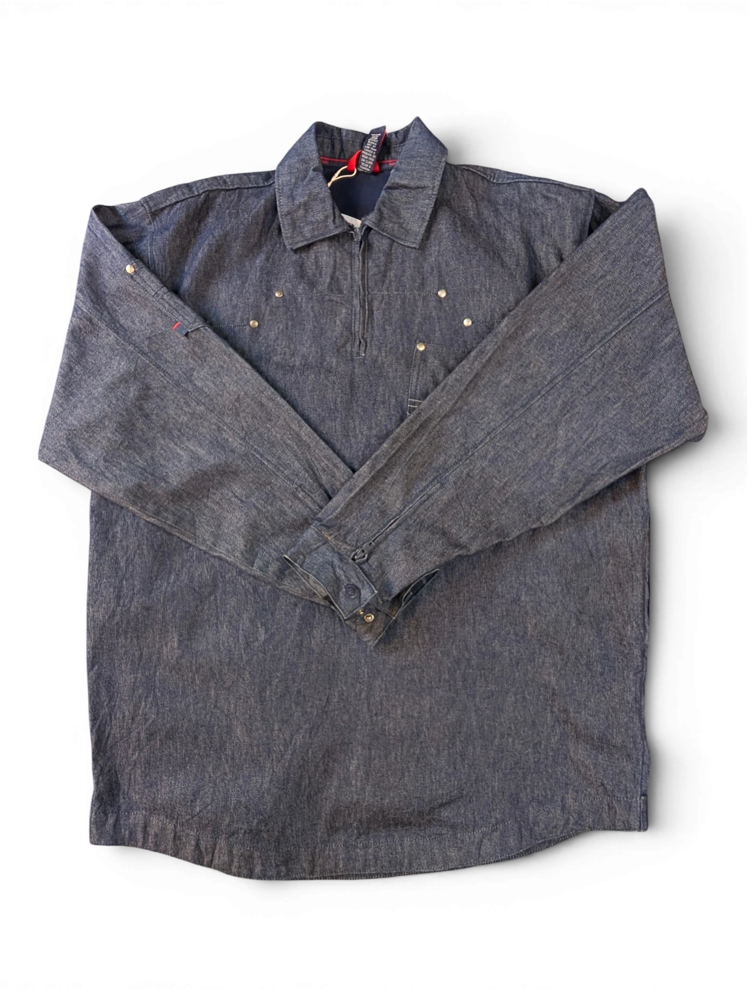 JAKE & IPI Willie Esco denim jacket with quarter zip, button cuffs, and brass stud details.