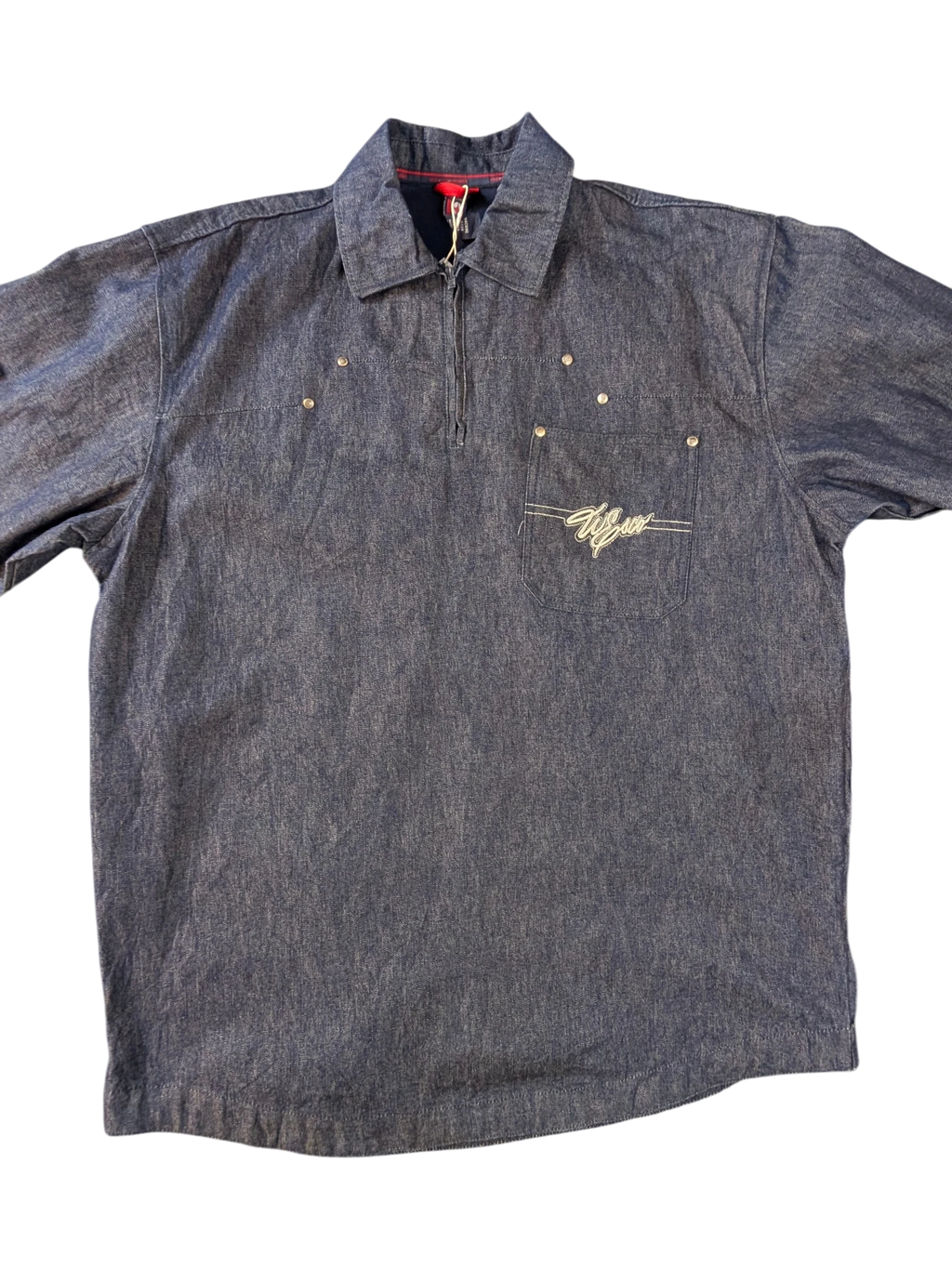 JAKE & IPI Willie Esco denim jacket with embroidered logo on chest pocket, silver stud details, and quarter zip closure.