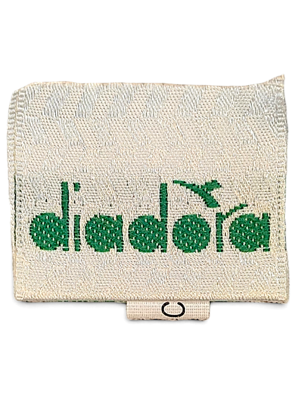 JAKE & IPI Diadora brand clothing label with green embroidered logo on a cream fabric tag