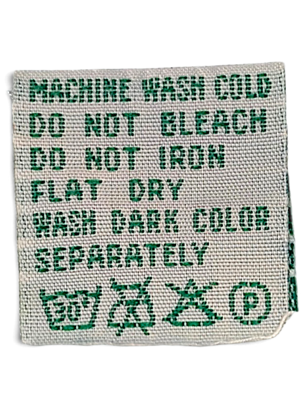 JAKE & IPI Diadora track pants care label with green text on white fabric showing washing instructions