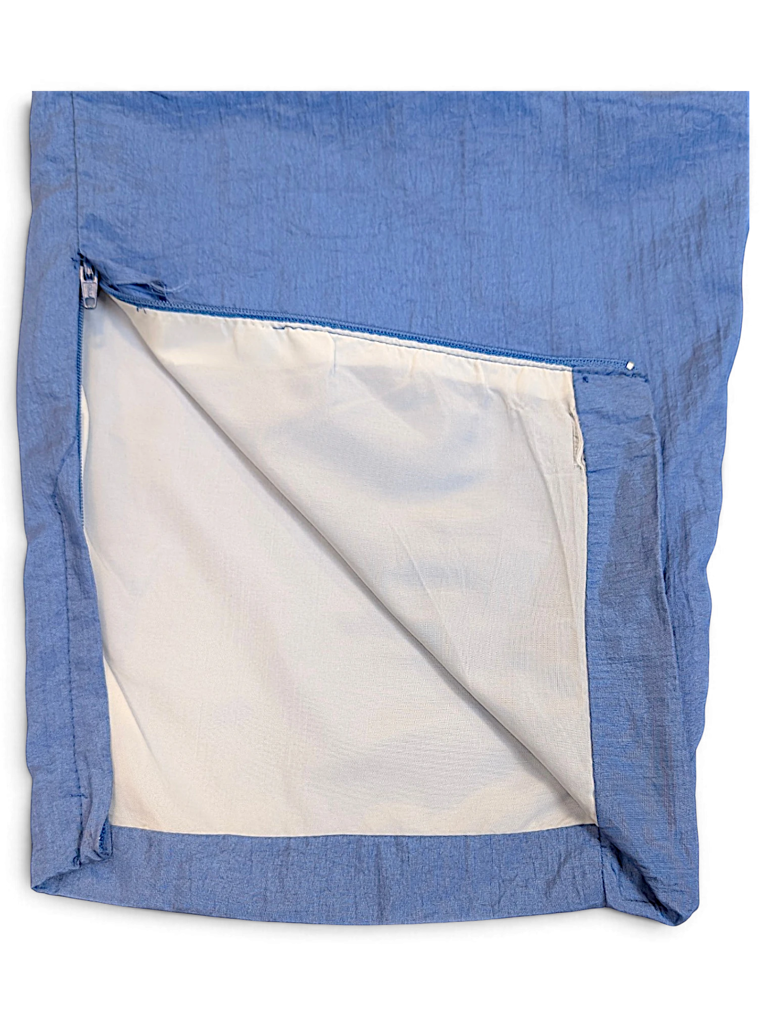 JAKE & IPI Diadora light blue track pants featuring a shiny finish and a zippered leg opening with white lining.
