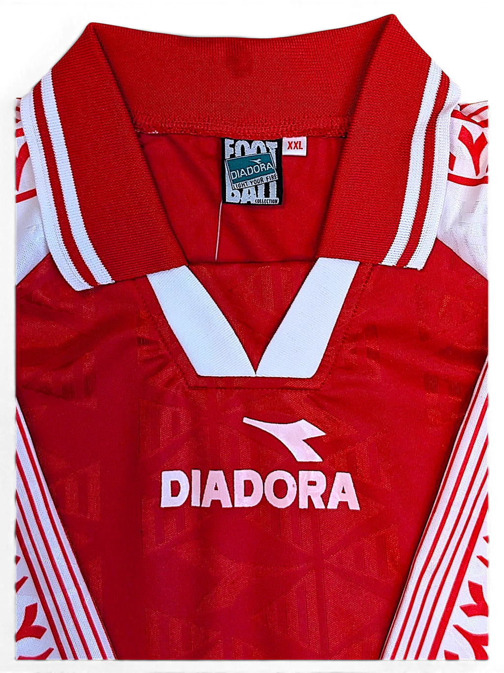 JAKE & IPI Diadora Grit red football jersey showing the collared V-neck opening