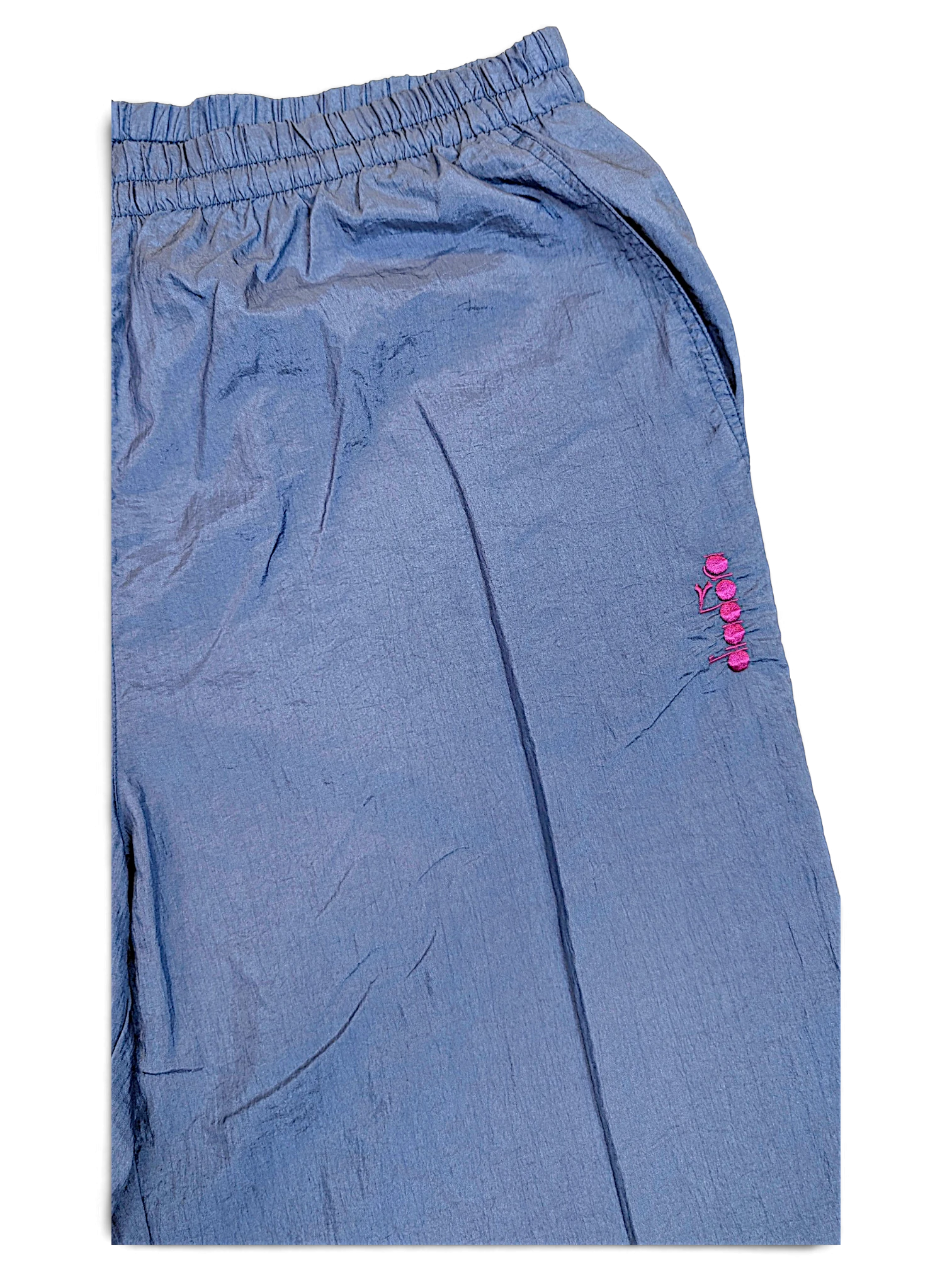 JAKE & IPI Diadora light blue shiny track pants with an elasticated waistband and pink embroidered logo detail.