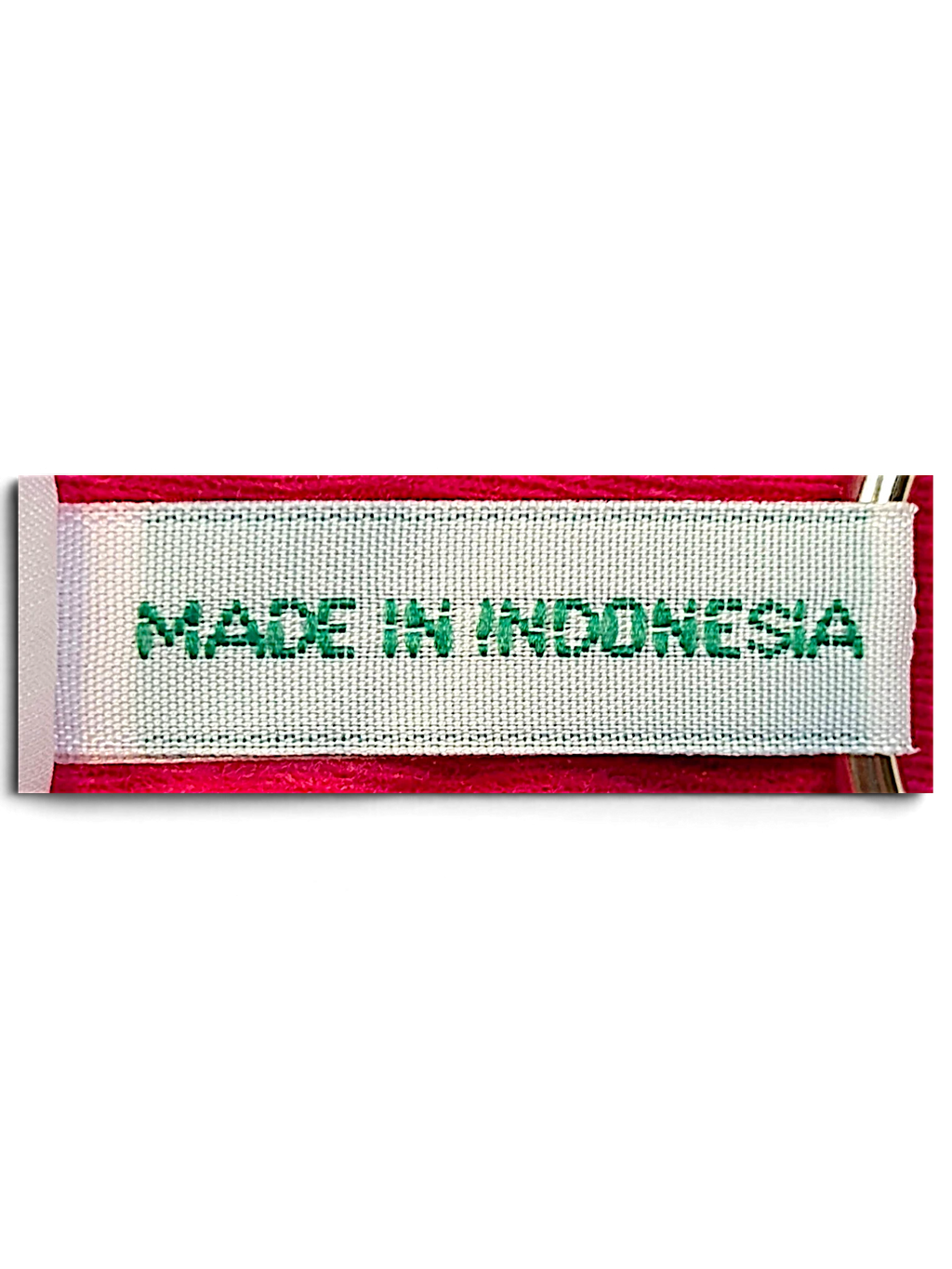 JAKE & IPI Diadora pink track pants garment tag showing Made in Indonesia text on a white fabric label