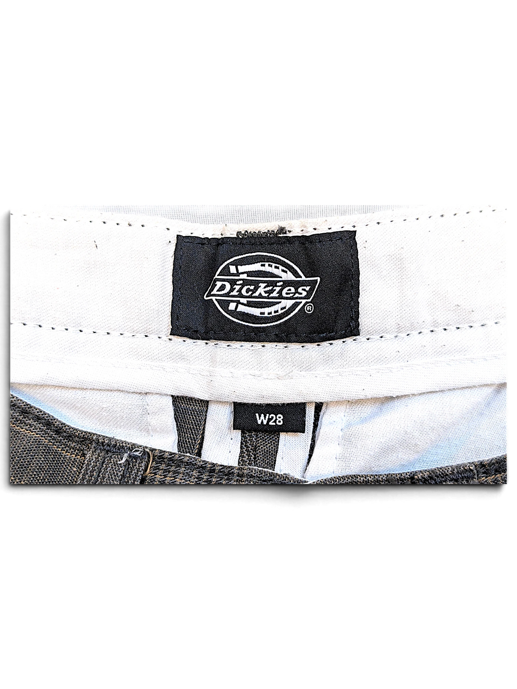 JAKE & IPI Dickies brand label and W28 size tag inside grey plaid pleated trousers