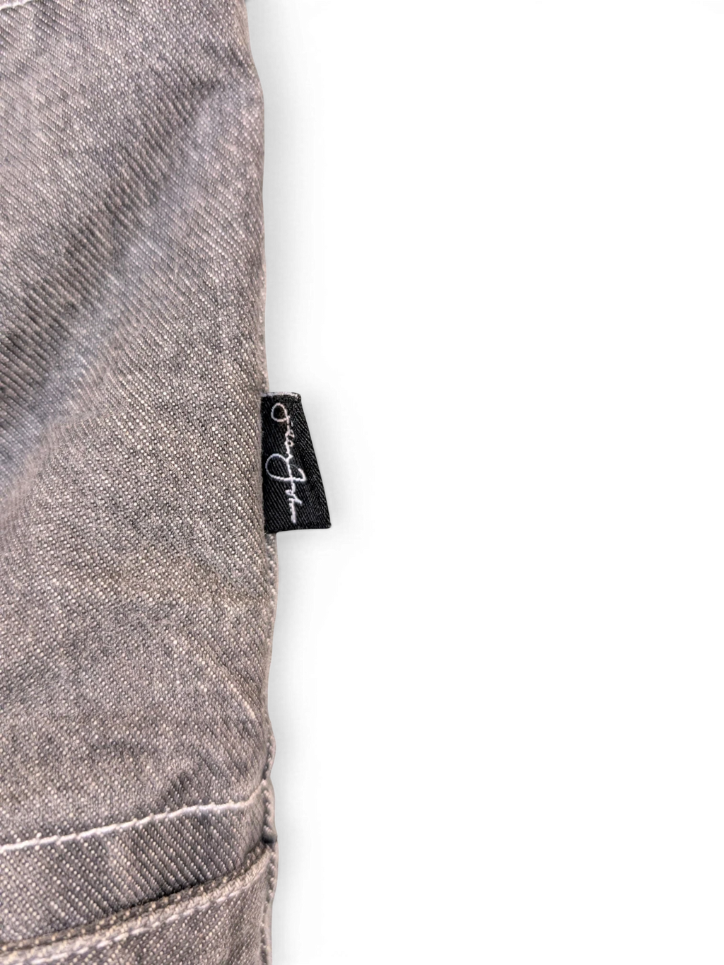 JAKE & IPI Diddy denim jacket in grey, featuring a black tag with white script logo.