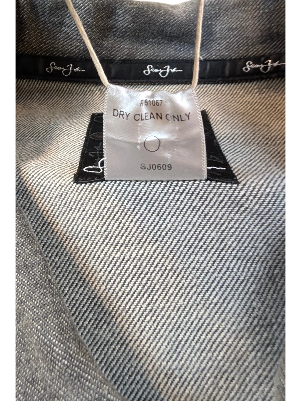 JAKE & IPI Diddy denim jacket with Sean John branding and care label.