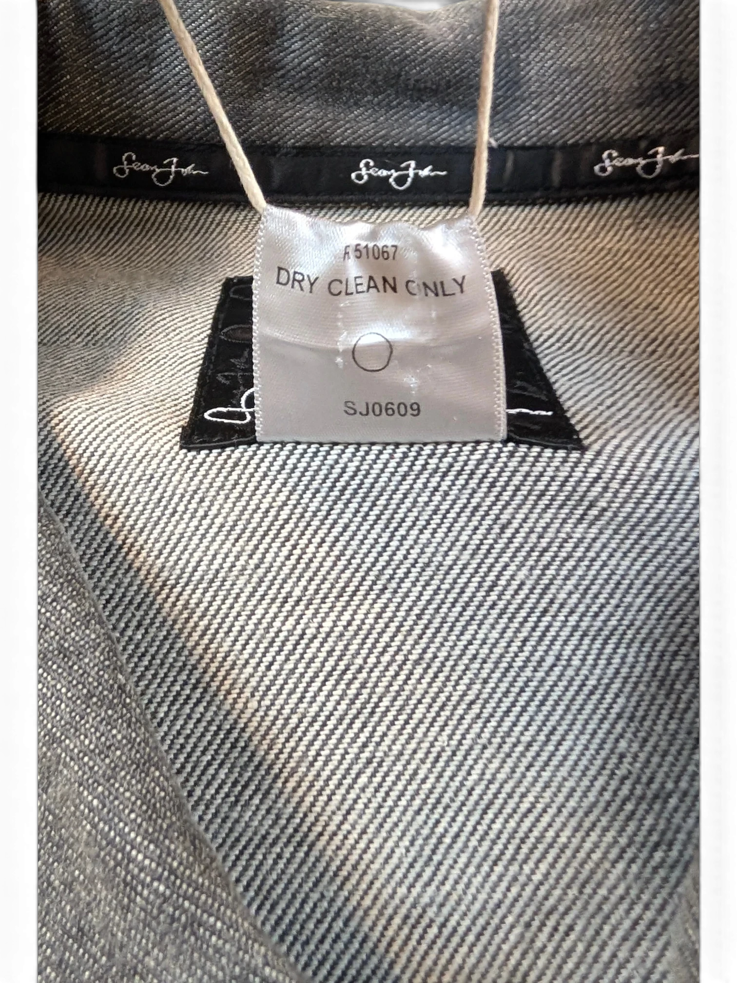 JAKE & IPI Diddy denim jacket with Sean John branding and care label.