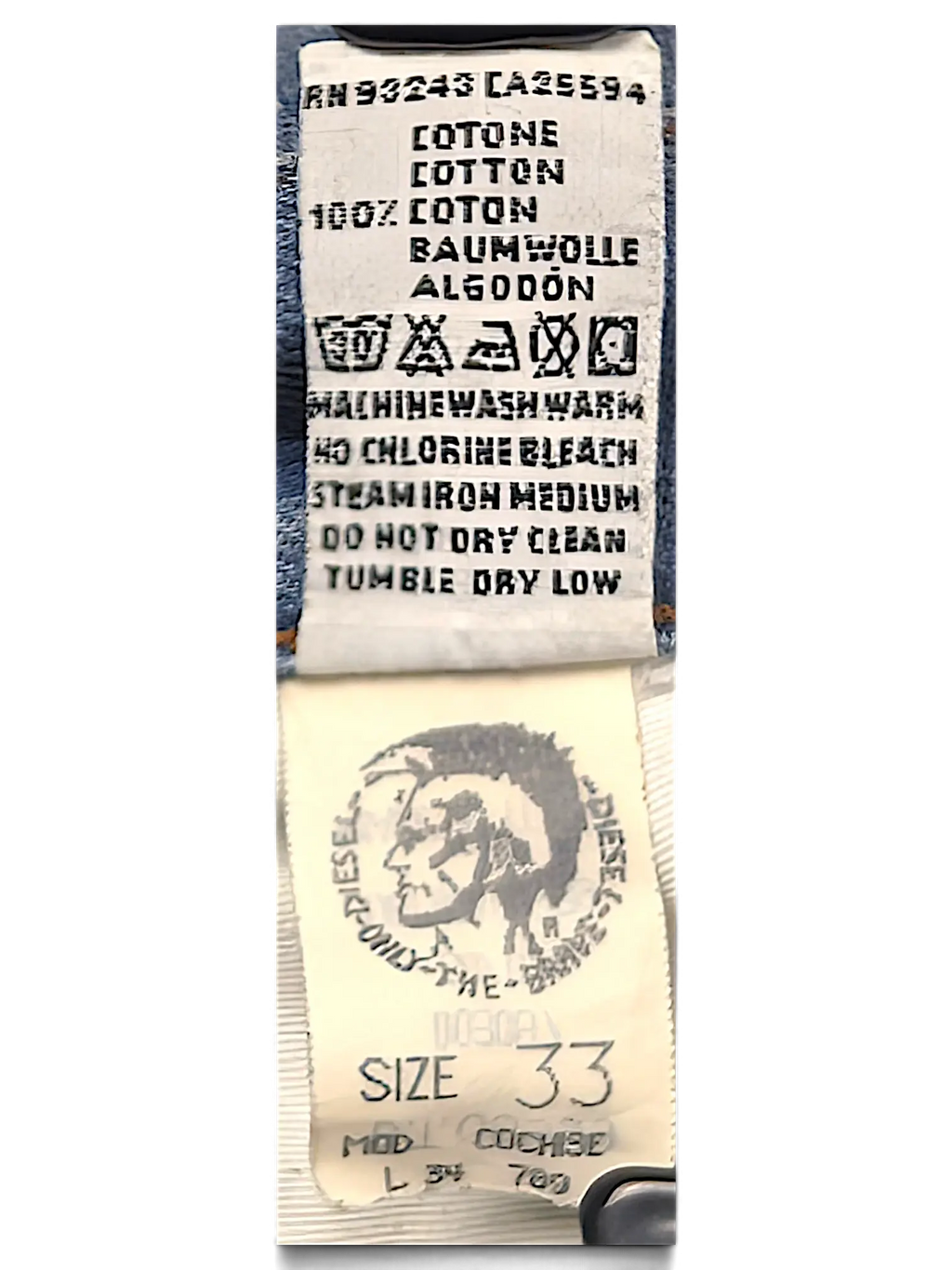 JAKE & IPI Diesel Basic jeans interior care label and size tag showing 100 percent cotton composition
