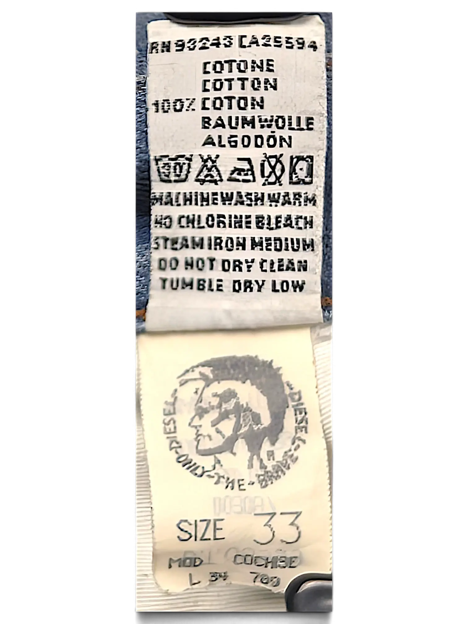 JAKE & IPI Diesel Basic jeans interior care label and size tag showing 100 percent cotton composition