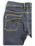 JAKE & IPI dark wash denim jeans with yellow stitching and a unique zippered back pocket featuring black velvet trim.